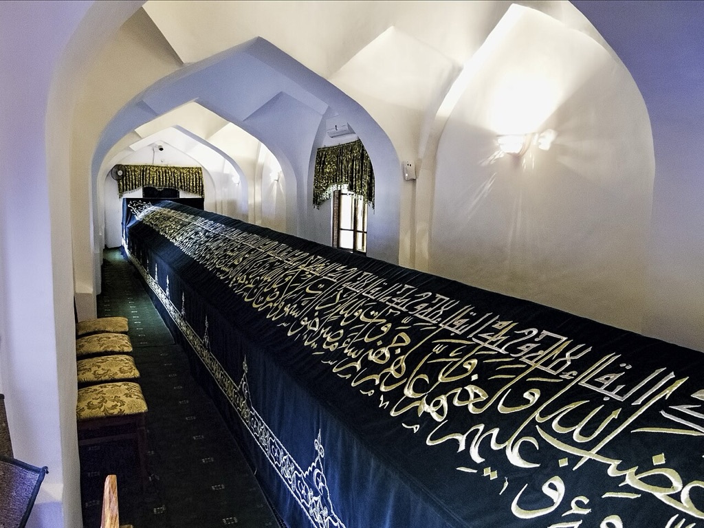 The eighteen-metre cenotaph inside the Tomb of Saint Daniel, Samarkand, draped in calligraphed cloth