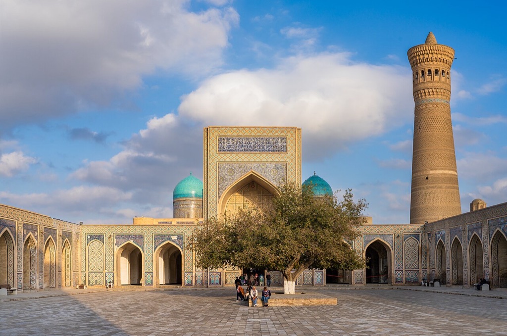 The Kalyan mosque courtyard and minaret in Bukhara's old town in late afternoon light