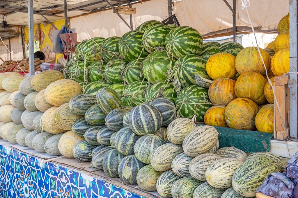 Melons piled for sale at a bazaar in Uzbekistan