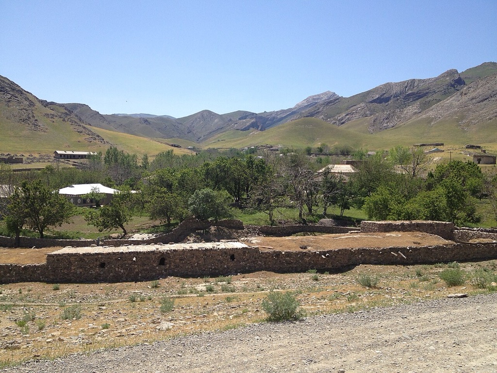 Mud-brick walls and orchards in Sap village below the Nuratau mountains, Uzbekistan